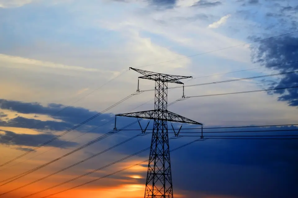 Electricity pylons at sunset, business energy supply in Northern Ireland